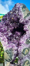Load image into Gallery viewer, Amethyst spinning rare and unique double sided with multiple calcites - deep purple colour gold stand Active