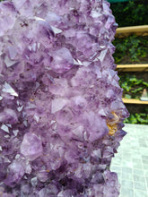 Load image into Gallery viewer, Amethyst with a heartbeat from Uruguay - With Orange red Calcite - Heartbeat Active
