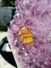 Load image into Gallery viewer, Amethyst with a heartbeat from Uruguay - With Orange red Calcite - Heartbeat Active

