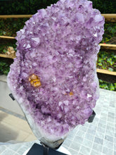 Load image into Gallery viewer, Amethyst with a heartbeat from Uruguay - With Orange red Calcite - Heartbeat Active
